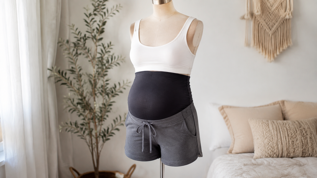Maternity shorts with supportive belly panel on a dress form
