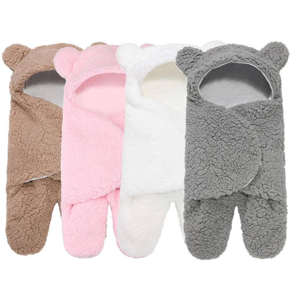 newborn hugging clothing package