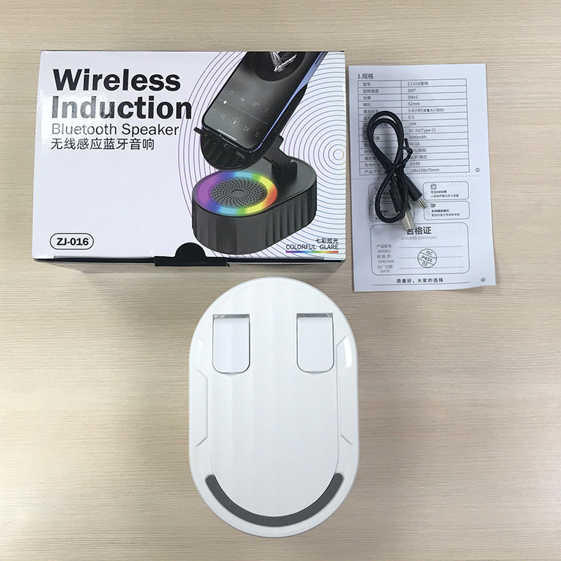 Inductive phone holder with speaker