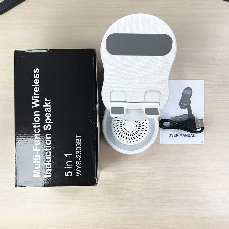 Inductive phone holder with speaker
