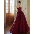 Evening dress in wine red strapless satin