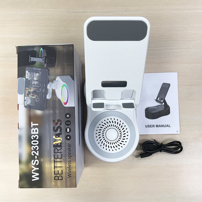 Inductive phone holder with speaker