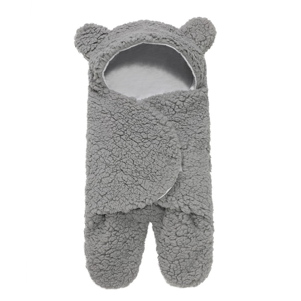 newborn hugging clothing package