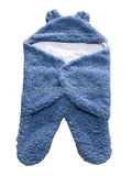 newborn hugging clothing package