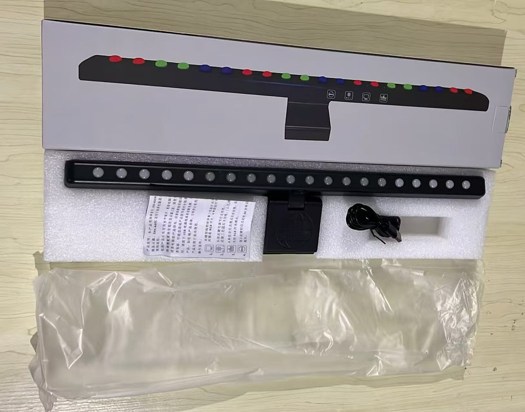 A hanging light on the computer monitor