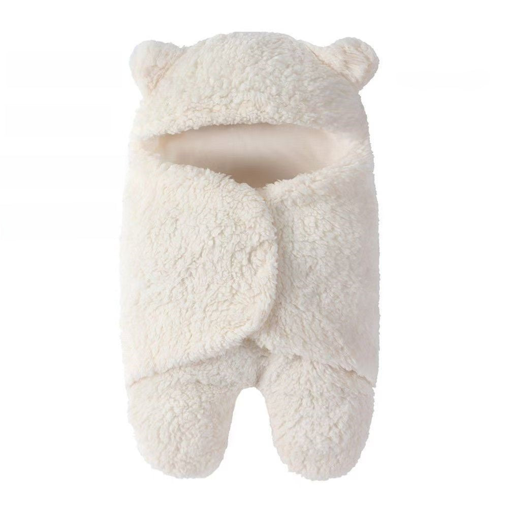 newborn hugging clothing package