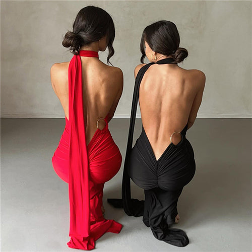 A backless, off-the-neck, body-hugging evening dress