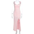 Sleeveless backless dress with adjustable ties and a fitted, slit design