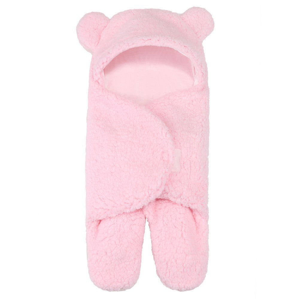 newborn hugging clothing package