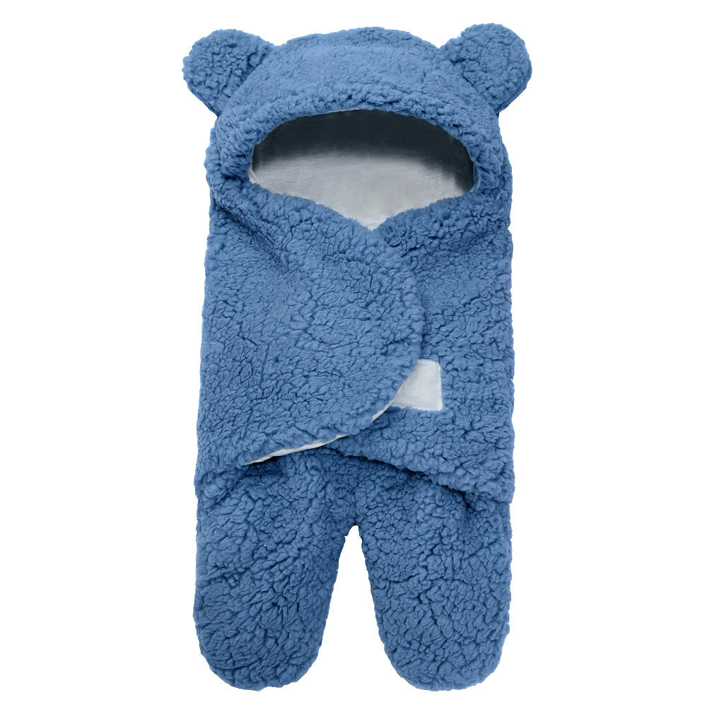 newborn hugging clothing package