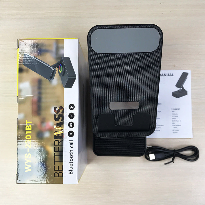 Inductive phone holder with speaker