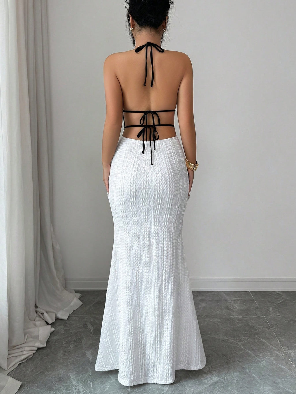 Deep V open-back fitted halter dress