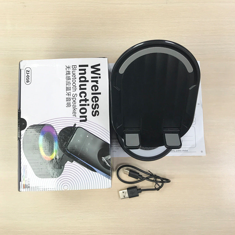 Inductive phone holder with speaker
